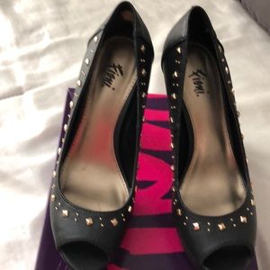 Black studded pumps